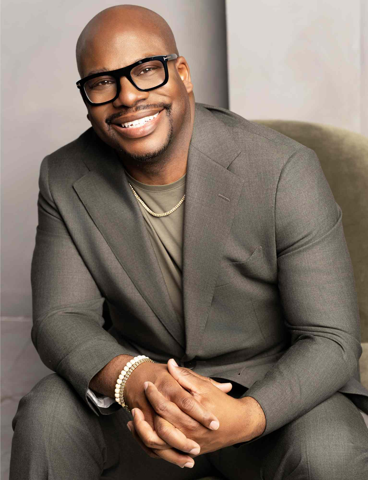 Laterras R. Whitfield seated and smiling